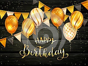 Golden Birthday Balloons and Pennants on Black Wooden Background