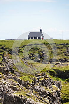 Black wooden church Budakirkja at Snaefellsnes, western Iceland.