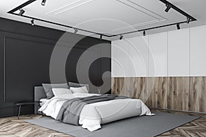 Black, wooden and white master bedroom corner