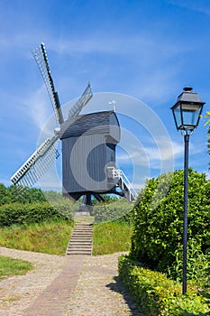Black wooden windmill in historic town Bourtange