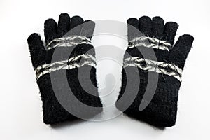 Black wool gloves on white background