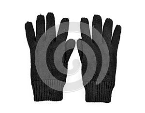 Black woolen gloves on snow