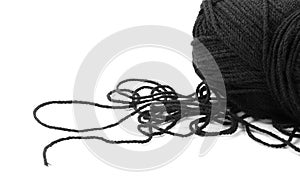 Black woolen threads. A skein of thread. Closeup. Isolated on a white background