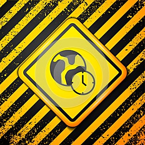 Black World time icon isolated on yellow background. Warning sign. Vector