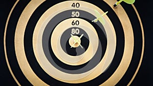 Black and yellow bullseye dart arrow hitting target center of dartboard. Concept of success, target, goal, achievement. selective
