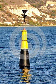 Black and yellow buoy on the Black Sea