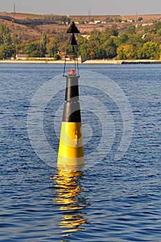 Black and yellow channel marker