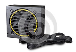 Black yellow computer atx format modular power supply with cables isolated white background. pc hardware component technology