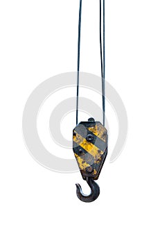 Black and yellow cranes hooks hanging on steel ropes isolated