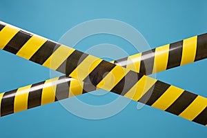 Black and yellow lines of barrier tape forbids passage. Concept of No entry