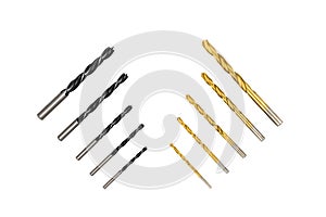 Black and yellow metal drill bits on white background isolated.