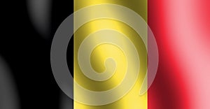 Black,yellow and red colored national flag of Belgium waving in the air.