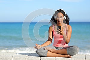 Black yogi preparing yoga video guide