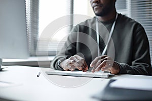 Black Young Man Typing on Computer Keyboard