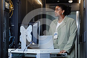 Black Young Woman in Server Room