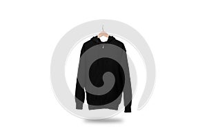 Black zip hoodie with wood hanger hanging on isolated white background