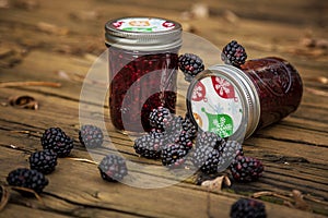 Blackberries with Blackberry jam in bottles.