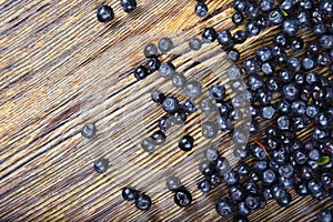 Blackberries and blueberries on wooden background