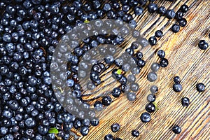 Blackberries and blueberries on wooden background