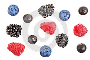 Blackberry blueberry raspberry black currant isolated on white background. Top view. Flat lay pattern