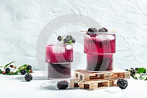 Blackberry cocktail on a light background. banner, menu, recipe place for text, top view