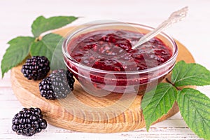 Blackberry jam in a glass bowl.Close-up.