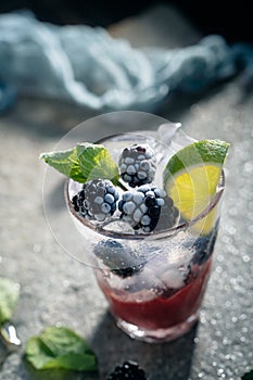 Blackberry lime mojito with mint and ice