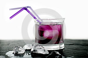 Blackberry liqueur glass with ice photo