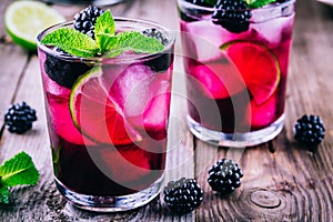 Blackberry smash cocktail with lime, and mint