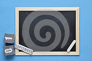 Blackboard with chalk blue background and September 01 on calendar.