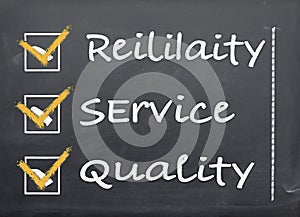 Blackboard with a checklist Reliability, Service and Quality