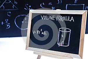 Blackboard with hand written geometry volume formulas