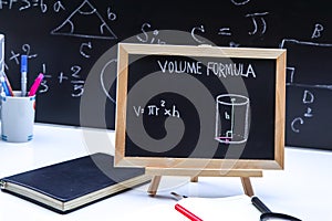 Blackboard with hand written geometry volume formulas
