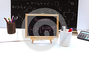 Blackboard with hand written Sequences and Series Formulas