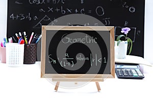 Blackboard with hand written Sequences and Series Formulas