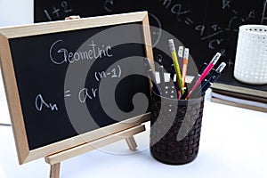 Blackboard with hand written Sequences and Series Formulas photo