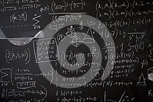 Blackboard with maths statistics, equations and ideas photo