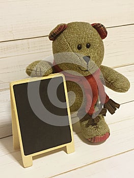 Blackboard for short note and teddy bear
