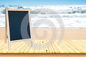 Blackboard sign and wood deck on the beach and blue sky,Re