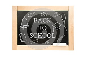 Blackboard with text back to school and drawings. School Board in wooden frame isolated on white background