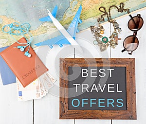 blackboard with text & x22;Best travel offers& x22;, plane, map, passport, money, sunglasses