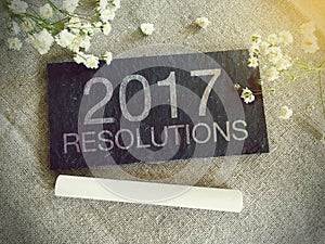 Blackboard for your text and flowers with words 2017 Resolutions