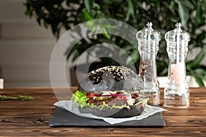 Blackburger black mamba with marbled beef a gray stone