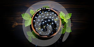 Blackcurrant banner. Bowl full of blackcurrant. Close-up food photography background