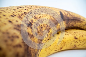 Blackened bananas close up on isolated