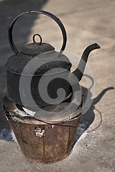 Blackened Kettle on a Fire Pot photo