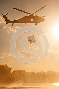 Blackhawk Helicopter carrying Humvee