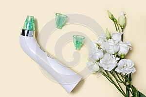Blackhead vacuum remover or pore cleaner is home beauty and skin care device for facial cleaning. Tender white flowers