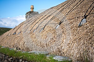 Blackhouse thatched roof in soft focus photo