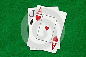 Blackjack hand on green table